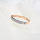 Martin diamond bracelet in 18K gold with 1.891 ct round diamonds and black ceramic accent - Zivar.in
